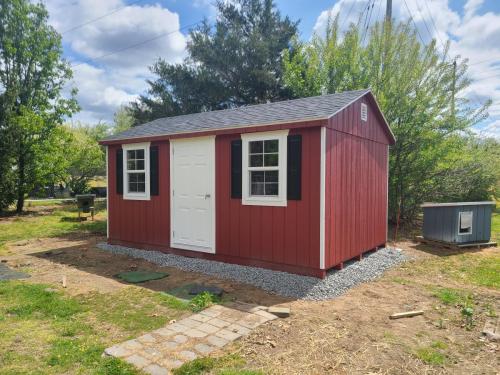 10x16-barn-red-a-frame-framed-door-black-raised-panel-shutters-2
