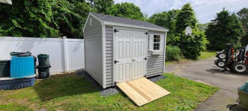 Patchogue-8x10-A-frame-flint-clapboard-black-roof-white-louvered-shutters-white-flowerbox